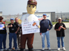 The Power Man's sign reads "Don't fall for it again...Stand up and Vote Union YES!"